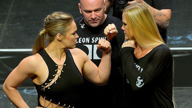 Holly Holm (right) was one of the most accomplished female boxers in history, but will her boxing experience help her at all against fearsome MMA bantamweight champ Ronda Rousey (left)?