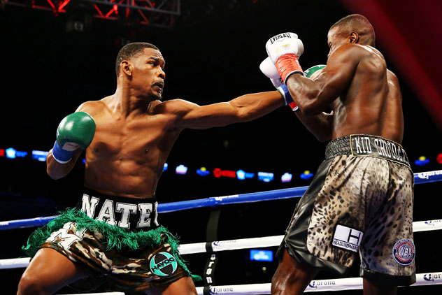 Daniel Jacobs (L) strikes Peter Quillin during what would be a brief night's work; Quillin was stopped at 1:25 of Round 1. Photo by Al Bello - Getty Images