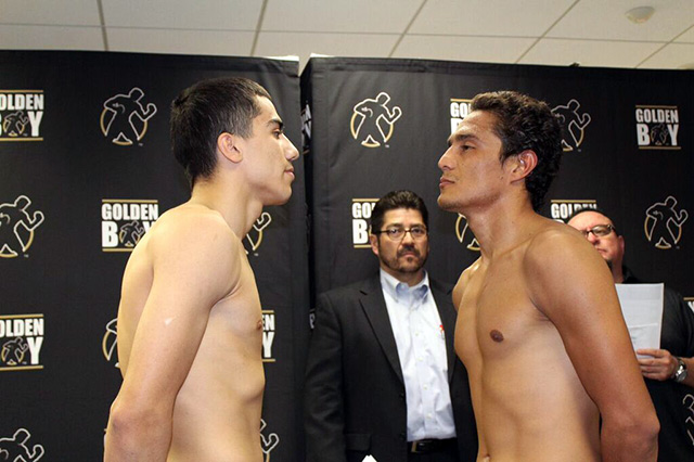 Christian Gonzalez (left) engages in a post-weigh-in staredown with Alejandro Ochoa (right), who came in three pounds over the contracted weight. Photo by Golden Boy Promotions