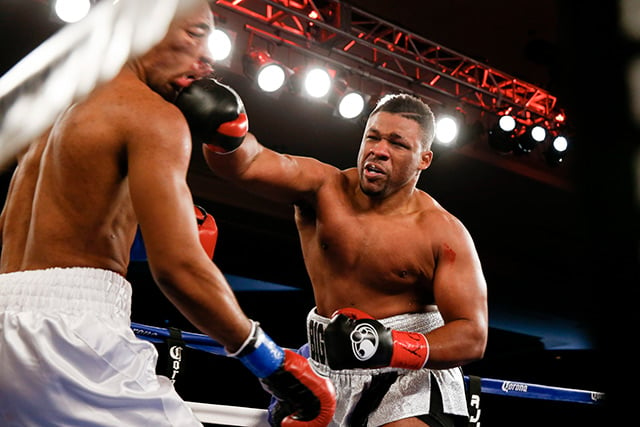 Heavyweight standout Jarrell Miller nails Donovan Denis with a big right hand en route to stopping the game but out-gunned opponent in the seventh round. Photo by Esther Lin / Shotime