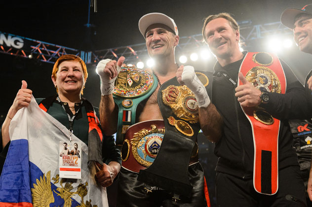 Sergey Kovalev of Russia (center) with his mother and with former NHL player Alexei Kovalev following his second win over Jean Pascal at the Bell Centre in Montreal, Canada.  Photo by Minas Panagiotakis/Getty Images