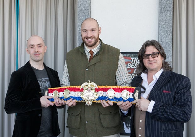 Heavyweight boxing champion Tyson Fury receives the Ring Magazine belt from Gareth A Davies and Tom Gray of Ring magazine, left, during a press conference at the Midland Hotel in Morecambe, Wednesday February 3rd, 2016. Picture by Dave Thompson/Route One Photography - 07711 459404 dave@routeonephotography.co.uk