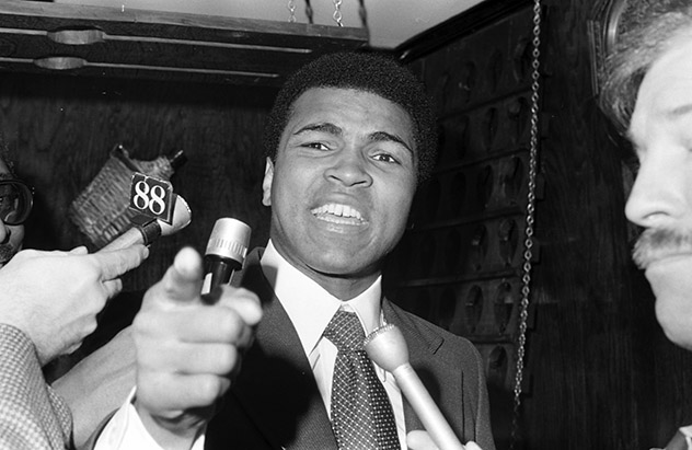 NEW YORK - JANUARY 17, 1974: Muhammad Ali speaks to the media as he taunts Joe Frazier during a press conference on January 17,1974 for bout II at Pen Restaurant in New York, New York. (Photo by: The Ring Magazine/Getty Images)