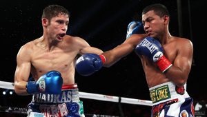 Sept. 10, 2016: Roman Gonzalez (right) battles toward his fourth division title, the WBC junior bantamweight title he took from Carlos Cuadras via unanimous decision. (Photo: Chris Farina - K2 Promotions)