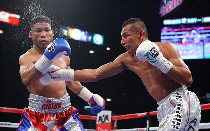 Robinson Castellanos (right) punches Yuriorkis Gamboa during their WBA elimination bout in May 2017. (Photo by Tom Hogan / Hoganphotos-Golden Boy Promotions)