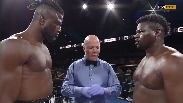 Heavyweight boxer Curtis Harper walks out of the ring after opening bell