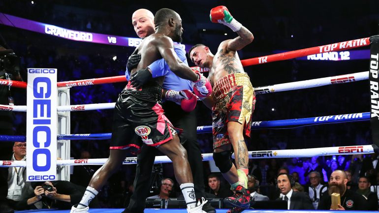 Terence Crawford finishes Jose Benavidez Jr. with 18 seconds left to retain title