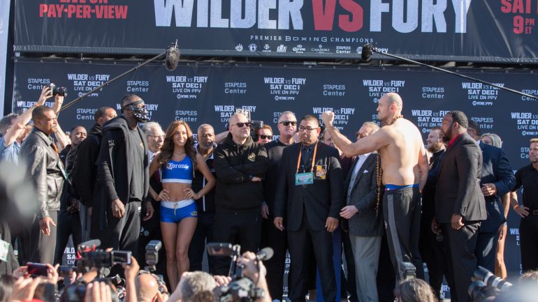 Deontay Wilder, Tyson Fury show off vastly different physiques at festive weigh-in