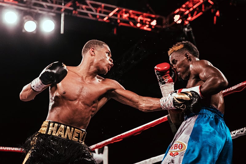Devin Haney (left) takes it to previously unbeaten (25-0) Xolisani Ndongeni. Photo by Rosie Cohe/SHOWTIME
