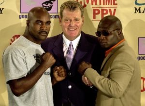(From left to right) Evander Holyfield, promoter Dan Goossen and James Toney in 2003. Photo credit: Laura Rauch/Associated Press
