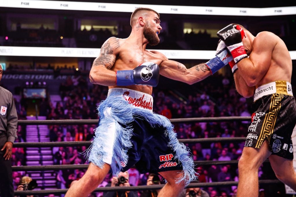 Caleb Plant (left) takes it to Vincent Feigenbutz. Photo by Stephanie Trapp/TGB Promotions