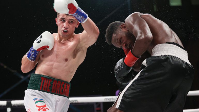 Israil Madrimov survives tough test – and questionable refereeing – to defeat Eric Walker