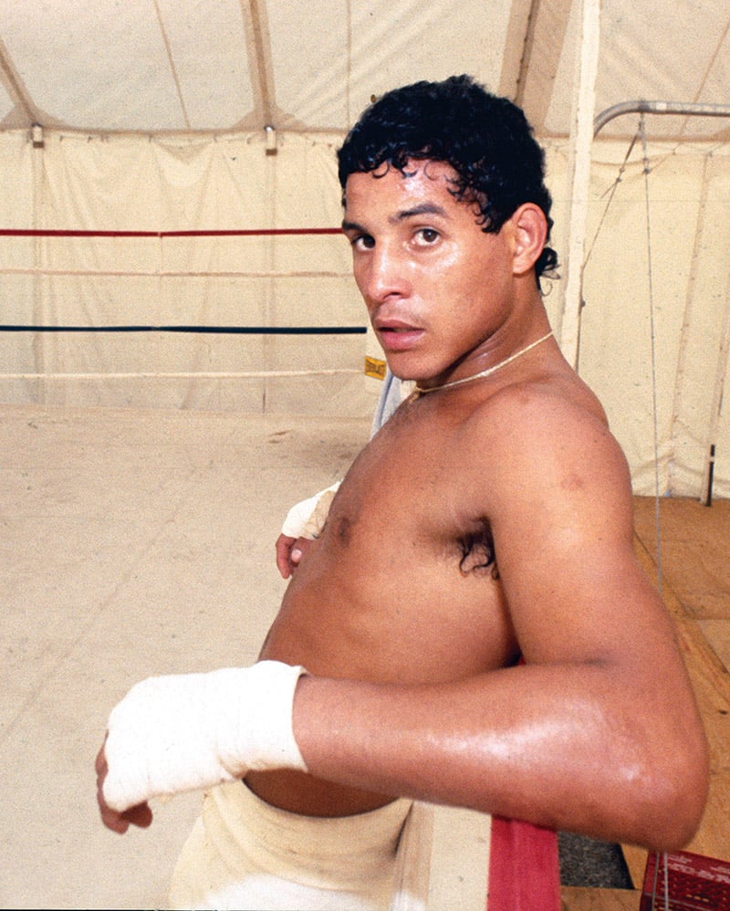 Hector Camacho takes a break during a training session in a tent on the gro...