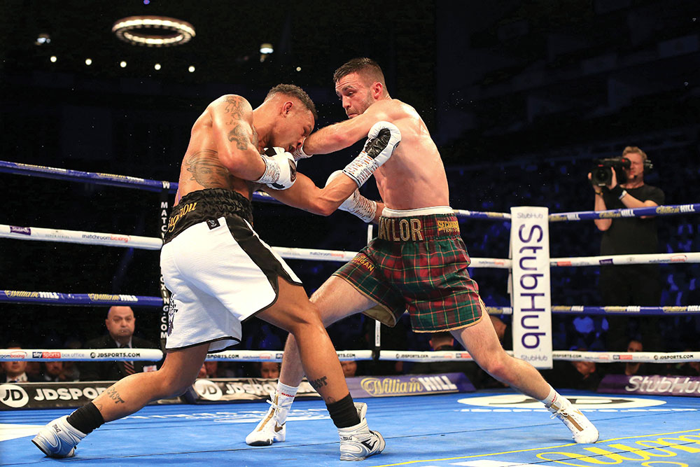 Regis Prograis and Josh Taylor (right) duked it out in a "Fight of the Year" candidate that saw both men elevate their reputations. (Photo by Stephen Pond/Getty Images)