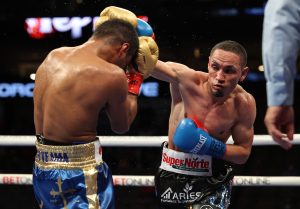 Juan Francisco Estrada (right) fires away at Roman "Chocolatito" Gonzalez in the March 2021 rematch. Photo by Melina Pizano/Matchroom Boxing.