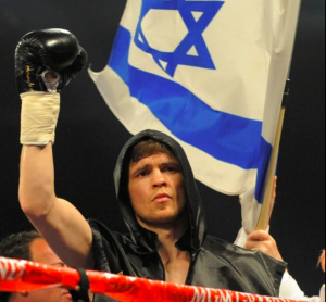 Yuri Foreman waves a flag to signify his pride in being a Jewish athlete.