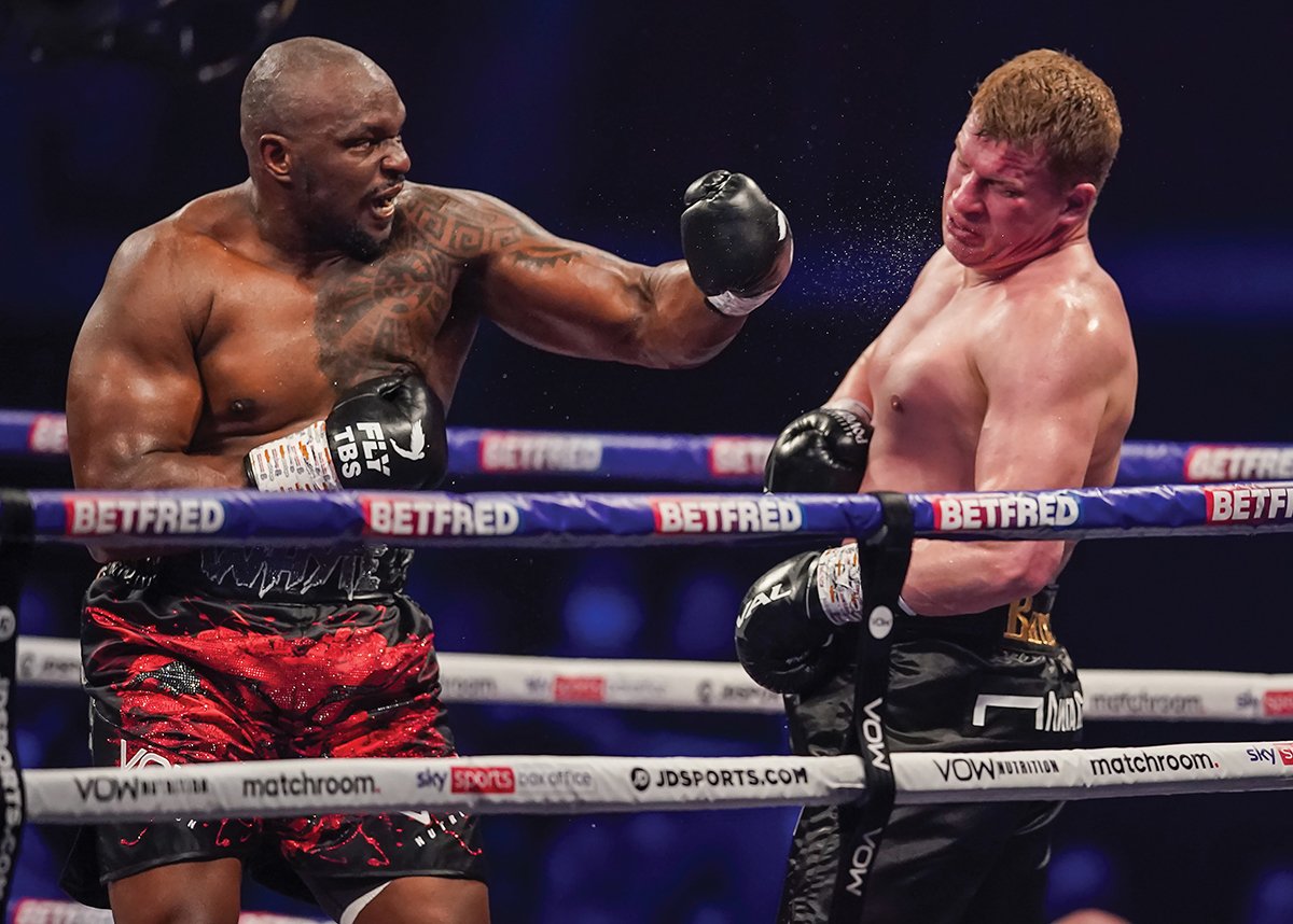 Dillian Whyte (left) tees off on Alexander Povetkin. Photo credit: Dave Thompson/Matchroom Boxing