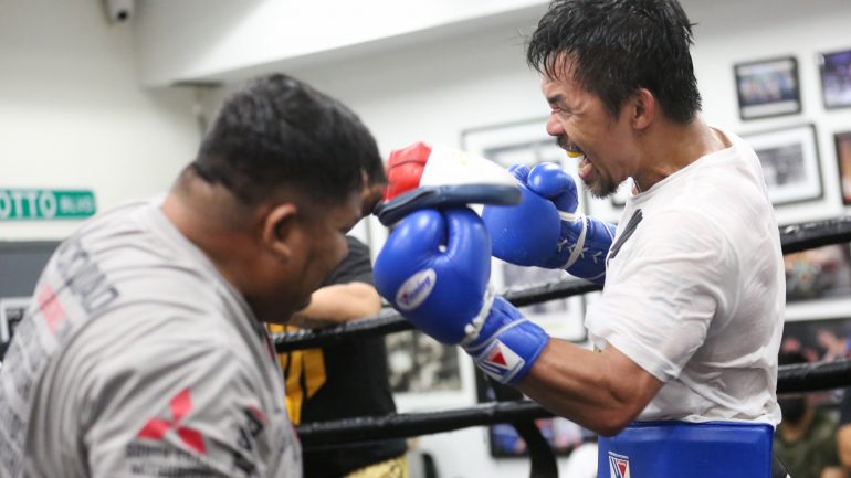 Photos: Manny Pacquiao pounds away on punch mitts at Wild Card Gym