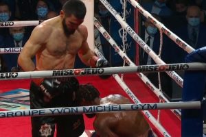 Artur Beterbiev (left) drops Marcus Browne to score a ninth-round TKO win to defend his unified light heavyweight titles on December 17, 2021