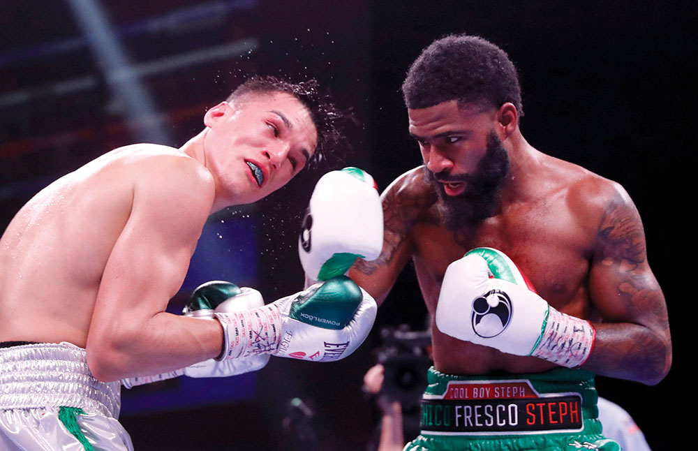 LAS VEGAS, NEVADA - NOVEMBER 27: WBO champion Stephen Fulton Jr. (R) punches WBC champion Brandon Figueroa during a super bantamweight title unification fight at the Dolby Live at Park MGM theater on November 27, 2021 in Las Vegas, Nevada. Fulton Jr. won the WBC title from Figueroa by majority decision. (Photo by Steve Marcus/Getty Images)