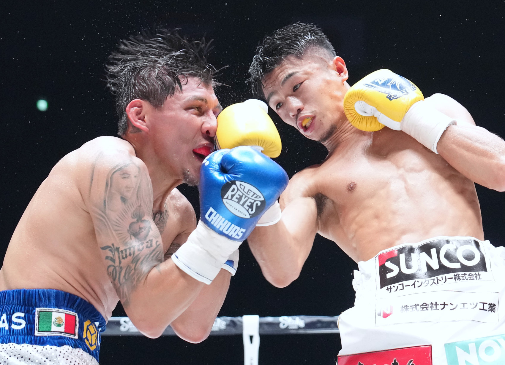 Junto Nakatani (right) won his 115-pound debut but Francisco Rodriguez Jr. made him earn it. Photo by Naoki Fukuda