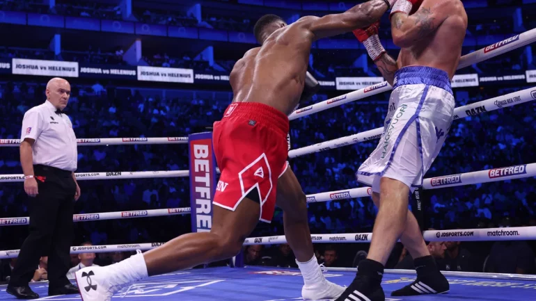 Anthony Joshua stops Robert Helenius in seven, stays on course for Deontay Wilder superfight